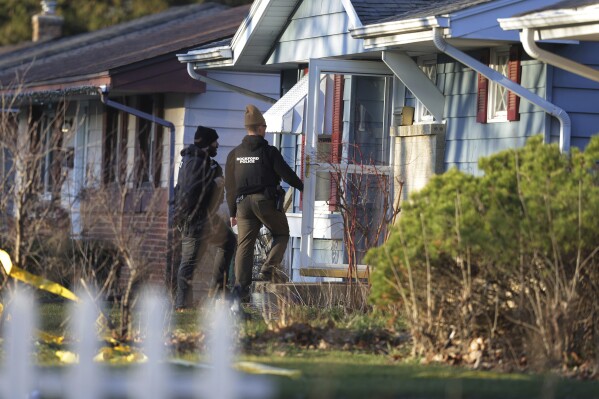 Police investigate stabbings that left several people dead and others injured, Wednesday, March 27, 2024, in Rockford, Ill. A 22-year-old man is in police custody and was being questioned Wednesday afternoon, according to Rockford Police Chief Carla Redd. (Stacey Wescott/Chicago Tribune via AP)