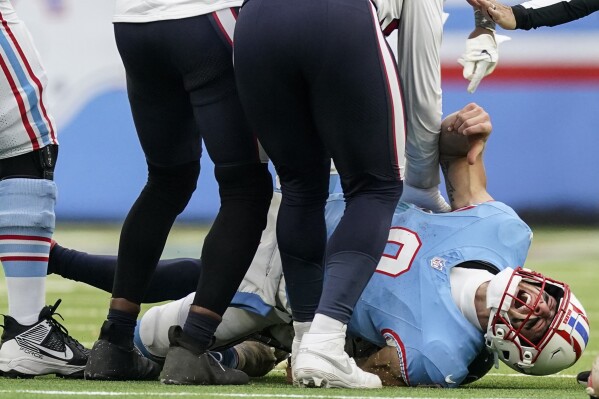Tennessee Titans quarterback Will Levis (8) is injured after being sacked against the Houston Texans during overtime of an NFL football game, Sunday, Dec. 17, 2023, in Nashville, Tenn. (AP Photo/George Walker IV)