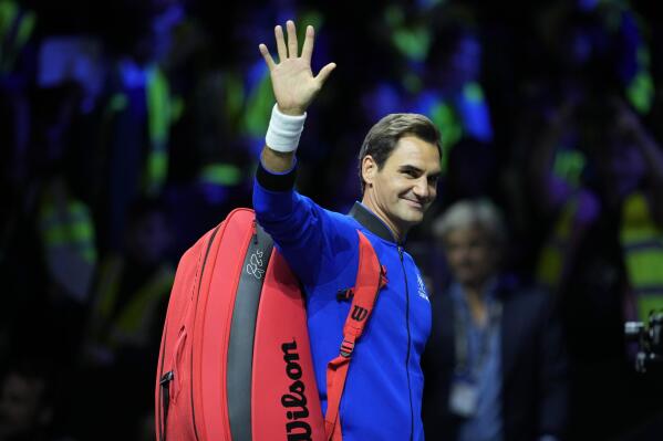 Switzerland's Roger Federer, waves during a training session ahead of the Laver Cup tennis tournament at the O2 in London, Thursday, Sept. 22, 2022. (AP Photo/Kin Cheung)
