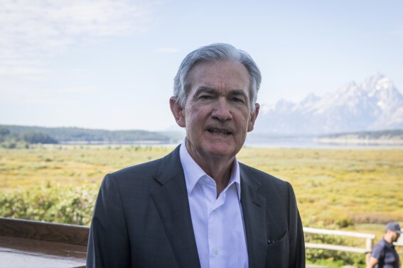FILE - Federal Reserve Chairman Jerome Powell takes a break outside of Jackson Lake Lodge during the Jackson Hole Economic Symposium near Moran in Grand Teton National Park, Wyo., Aug. 25, 2023. Powell swore in three members of the central bank's governing board Wednesday, Sept. 13, including Philip Jefferson as vice chair and Adriana Kugler to fill a vacant seat as the central bank's first Latina governor. (AP Photo/Amber Baesler, File)