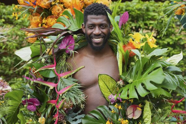 Dane Foxx from Acacia Creative Studio models a floral outfit at the RHS Chelsea Flower Show in London, Monday, May 19, 2025. (AP Photo/Kirsty Wigglesworth)