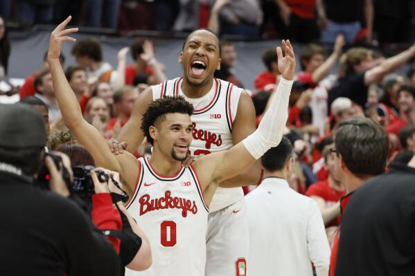 Ohio State's Tanner Holden, front, celebrates his game-winning basket against Rutgers with Zed Key during an NCAA college basketball game on Thursday, Dec. 8, 2022, in Columbus, Ohio. (AP Photo/Jay LaPrete)