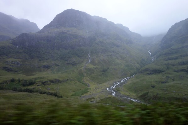 The Scottish Highlands are shown in this 2017 photo. Police say the bodies of three missing hikers have been recovered from a mountain in the Scottish Highlands. A search for the trio began Saturday night when they didn't return from hiking along a notoriously narrow ridge in Glen Coe. A Coastguard helicopter flying in fog and mist located the bodies and a search and rescue crew returned Sunday to recover them. (AP Photo/Brian Melley)