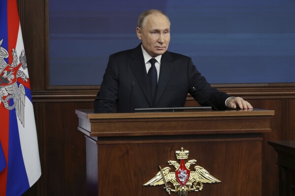 Russian President Vladimir Putin speaks during a meeting with the top military brass in Moscow, Russia, Tuesday, Dec. 19, 2023. (Mikhail Klimentyev, Sputnik, Kremlin Pool Photo via AP)