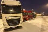 Ukrainian truck drivers wait to cross from Poland back into Ukraine in Korczowa, Poland, on Thursday Dec. 7, 2023. Ukrainian charities and companies supplying the country’s military warn that problems are growing as Polish truck drivers show no sign of ending a monthlong border blockade. (AP Photo/Karl Ritter)