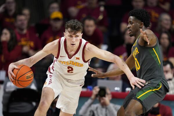 Iowa State guard Caleb Grill (2) drives past Baylor guard Adam Flagler (10) during the first half of an NCAA college basketball game, Saturday, Dec. 31, 2022, in Ames, Iowa. (AP Photo/Charlie Neibergall)