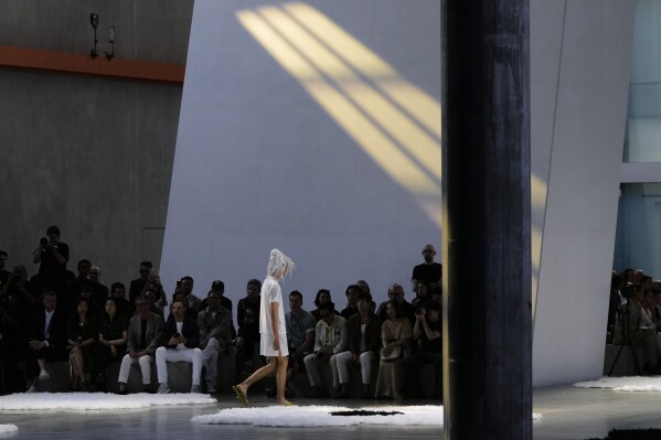 A model wears a creation as part of the men's Prada Spring-Summer 2026 collection, that was presented in Milan, Italy, Sunday, June 22, 2025. (AP Photo/Luca Bruno)