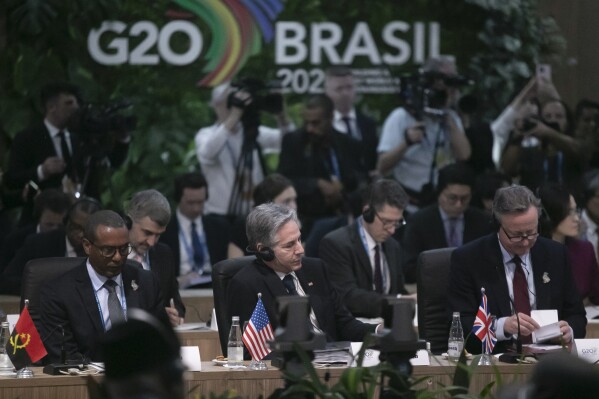 British Foreign Secretary David Cameron, right, U.S. Secretary of State Antony Blinken, center, and Angola's Economic Cooperation Minister Jose Massano, left, attend the G20 foreign ministers' meeting in Rio de Janeiro, Brazil, Wednesday, Feb. 21, 2024. (AP Photo/Bruna Prado)