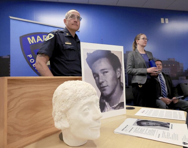 Madison Police Department Mid Town District Capt. Jason Freedman and Det. Lindsey Ludden talk with members of the media during a press conference at the Madison Police Department's Central District in Madison, Wis., Monday, May 13, 2024. The press conference was held to announce the identification of Ronnie Joe Kirk of Tulsa, Okla. as the person whose remains were discovered in a chimney of a former music store in the city In 1989. (John Hart/Wisconsin State Journal via AP)