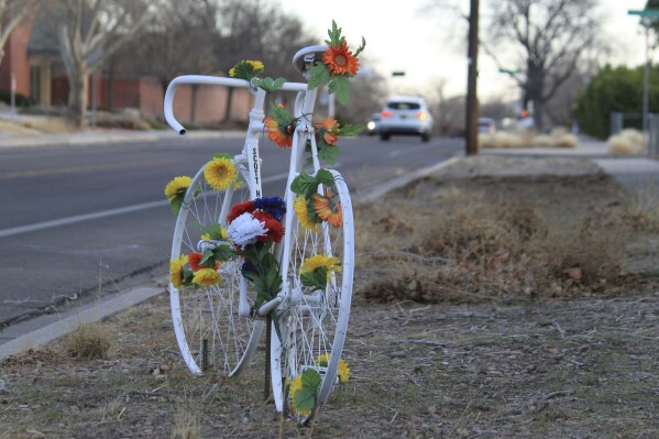 This March 20, 2025 photo shows a memorial ghost bike near the spot where Scott Dwight Habermehl was struck and fatally injured in May 2024 while biking to work at Sandia National Laboratories in Albuquerque, N.M. (AP Photo/Susan Montoya Bryan,File)