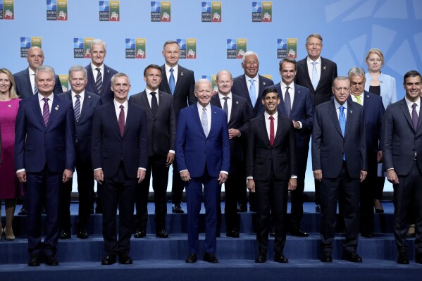 NATO heads of state and government pose during a group photo at a NATO summit in Vilnius, Lithuania, Tuesday, July 11, 2023. Front row left to right, Lithuania's President Gitanas Nauseda, NATO Secretary General Jens Stoltenberg, U.S. President Joe Biden, British Prime Minister Rishi Sunak, Turkish President Recep Tayyip Erdogan and Spain's Prime Minister Pedro Sanchez. (AP Photo/Pavel Golovkin)