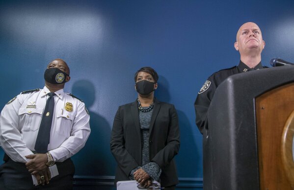 Atlanta Police Department interim Chief Rodney Bryant, from left, Atlanta Mayor Keisha Lance Bottoms, center, and Captain Jay Baker, of the Cherokee County Sheriff's Office, take questions during a press conference Wednesday, March 17, 2021, at the Atlanta Police Department headquarters in Atlanta on the arrest of Robert Aaron Long. Long is accused of killing multiple people, most of whom were of Asian descent, at massage parlors in the Atlanta area. (Alyssa Pointer/Atlanta Journal-Constitution via AP)