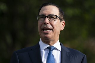 Treasury Secretary Steven Mnuchin speaks with reporters about the coronavirus relief package negotiations, at the White House, Thursday, July 23, 2020, in Washington. (AP Photo/Evan Vucci)