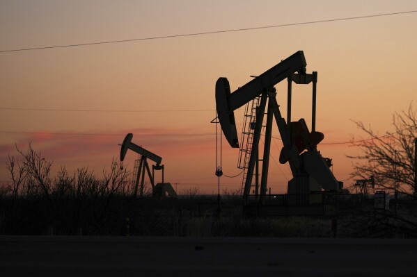 Pumpjacks are seen before sunrise in Hobbs, N.M., Feb. 24, 2025. (AP Photo/Julio Cortez, File)