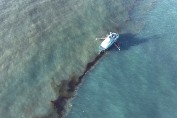 In this photo provided by the U.S. Coast Guard, a Clean Gulf Associates 95-foot response vessel skims crude oil approximately 4 miles southeast off South Pass Louisiana, Friday, Nov. 17, 2023. A Unified Command composed of the Coast Guard, Main Pass Oil Gathering Company, LLC, and the Louisiana Oil Spill Coordinator's Office is coordinating measures to assess, contain and mitigate the impact of the spill. (U.S. Coast Guard/Courtesy Clean Gulf Associates via AP)