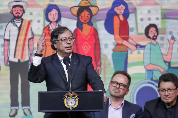 FILE - Colombian President Gustavo Petro holds a ceremony to formally begin a six-month cease-fire as part of a process to forge permanent peace with the National Liberation Army (ELN) in Bogota, Colombia, Aug. 3, 2023. Colombia’s government has extended a cease-fire with the FARC-EMC rebel group that was set to expire in Jan. 2024, as both sides hold peace talks in Bogota in an effort to reduce violence in rural parts of the country. (AP Photo/Ivan Valencia, File)