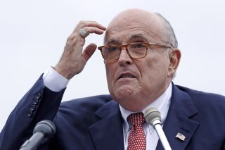 FILE - In this Aug. 1, 2018 file photo, Rudy Giuliani, an attorney for President Donald Trump, speaks in Portsmouth, N.H. Giuliani’s latest scattershot media blitz, which was filled with a dizzying array of wild misstatements, hurried clarifications and eyebrow-raising assertions, agitated President Donald Trump and some of his allies. (AP Photo/Charles Krupa, File )
