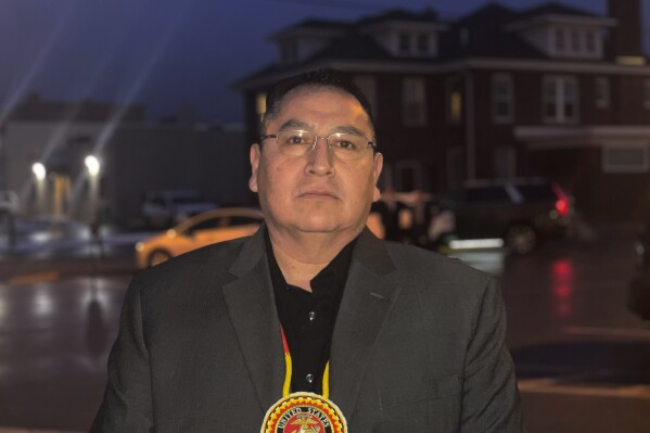 FILE - Oglala Sioux Tribe President Frank Star Comes Out stands outside the Andrew W. Bogue Federal Building and U.S. Courthouse in Rapid City, S.D. on Feb. 8, 2023. Star Comes Out said on Friday, Nov. 17, 2023, that he will declare a state of emergency on the tribe's Pine Ridge Reservation in South Dakota because of rampant crime that he said hasn’t been curbed due to the U.S. government’s inadequate funding for law enforcement on the reservation.(Kalle Benallie/Indian Country Today via AP, File)