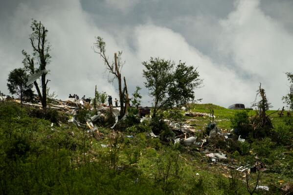 Debris and heavy damage are seen from severe weather, Friday, May 30, 2025, in Springfield, Ky. (AP Photo/Michael Swensen)