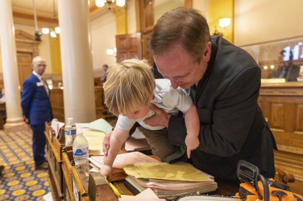 Conor McCrory, 2, casts a vote on behalf of state Sen. Chuck Hufstetler, R-Rome, at the Senate in the Capitol in Atlanta on Sine Die, the last day of the legislative session, Thursday, March 28, 2024. (Arvin Temkar/Atlanta Journal-Constitution via AP)