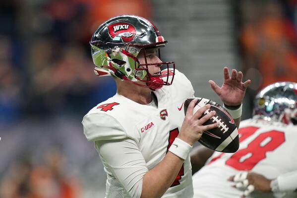 Western Kentucky quarterback Bailey Zappe (4) looks to pass against UTSA during the first half of an NCAA college football game in the Conference USA Championship, Friday, Dec. 3, 2021, in San Antonio. (AP Photo/Eric Gay)
