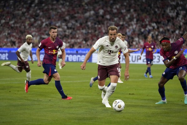 Bayern's Harry Kane controls the ball during the German Super Cup final between FC Bayern Munich and RB Leipzig at the Allianz Arena stadium in Munich, Germany, Saturday, Aug. 12, 2023. (AP Photo/Matthias Schrader)