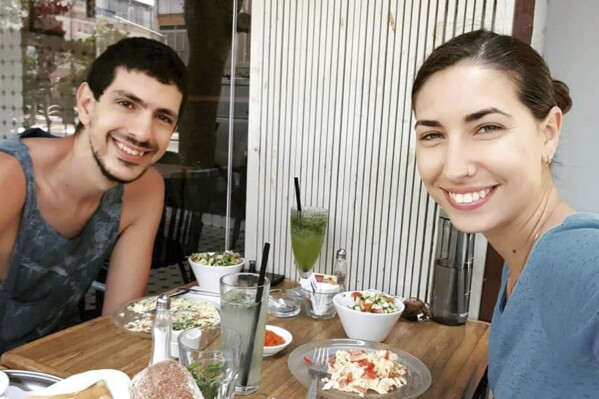 This undated and unknown location photo shows married couple Or Levy, 33, and Eynav Elkayam Levy, 32. The couple fled the Nova music festival on Oct. 7 when Hamas rockets flew overhead and hid in a bomb shelter. Enyav’s family was told she was killed there and Or was taken hostage. (Michael Levy via AP)