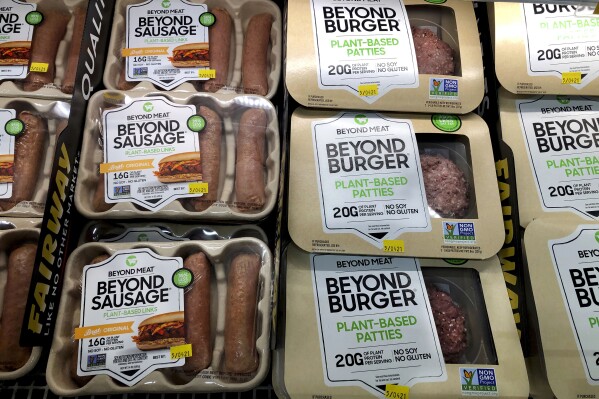 FILE - Packages of Beyond Meat's Beyond Burgers and Beyond Sausage, are shown in this photo, in New York, Thursday, April 29, 2021. (AP Photo/Richard Drew, File)