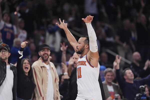 New York Knicks' Jalen Brunson (11) gestures to fans during the second half of Game 6 in the Eastern Conference semifinals of the NBA basketball playoffs against the Boston Celtics Friday, May 16, 2025, in New York. (AP Photo/Frank Franklin II)