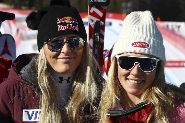 FILE - United States' Lindsey Vonn, left, and Mikaela Shiffrin pose for a photo after an alpine ski, women's World Cup super-G, in Cortina d'Ampezzo, Italy, Sunday, Jan. 29, 2017. Mikaela Shiffrin has matched Lindsey Vonn’s women’s World Cup skiing record with her 82nd win at the women's World Cup giant slalom race, in Kranjska Gora, Slovenia, on Sunday, Jan. 8, 2023. (AP Photo/Alessandro Trovati, File)