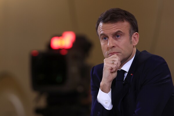 French President Emmanuel Macron listens to a question during his first prime-time news conference to announce his top priorities for the year as he seeks to revitalize his presidency, vowing to focus on "results" despite not having a majority in parliament, Tuesday, Jan. 16, 2024 at the Elysee Palace in Paris. (AP Photo/Aurelien Morissard)