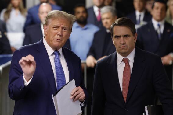 Former U.S. President Donald Trump speaks after exiting the courtroom alongside his attorney Todd Blanche during his trial at Manhattan Criminal court, Monday, May 20, 2024, in New York. (Michael M. Santiago/Pool Photo via AP)