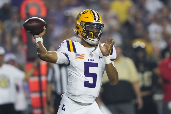 LSU quarterback Jayden Daniels (5) passes in the first half of an NCAA college football game against Army in Baton Rouge, La., Saturday, Oct. 21, 2023. (AP Photo/Gerald Herbert)