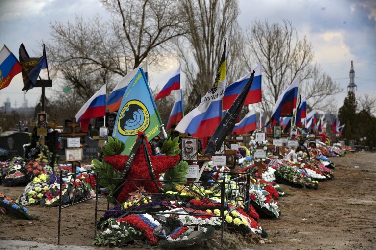 Graves of Russian servicemen killed in Ukraine in a cemetery in Russia’s Volgograd region on Saturday, March 30, 2024. Russian president Vladimir Putin’s influence is so dominant that other officials could only stand by submissively as he launched a war in Ukraine despite expectations the invasion would bring international opprobrium and harsh economic sanctions, as well as cost Russia dearly in the blood of its soldiers. (AP Photo)