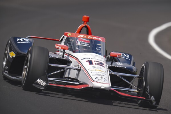 Will Power, of Australia, drives through the first turn during qualifications for the Indianapolis 500 auto race at Indianapolis Motor Speedway in Indianapolis, Saturday, May 18, 2024. (AP Photo/Michael Conroy)