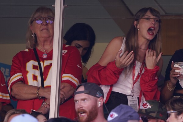 File - Taylor Swift, right, watches from a suite alongside Travis Kelce's mother, Donna Kelce, inside Arrowhead Stadium during the first half of an NFL football game between the Chicago Bears and Kansas City Chiefs Sunday, Sept. 24, 2023, in Kansas City, Mo. Following the 12-time Grammy Award winner's appearance at the game, jersey sales for the All-Pro tight-end seemingly skyrocketed. (AP Photo/Ed Zurga, File)