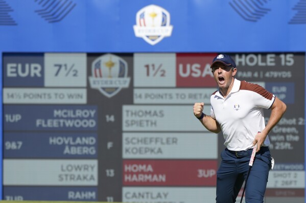 Europe's Rory Mcilroy celebrates after putting on the 15th green during their morning Foursomes match at the Ryder Cup golf tournament at the Marco Simone Golf Club in Guidonia Montecelio, Italy, Saturday, Sept. 30, 2023. (AP Photo/Alessandra Tarantino)