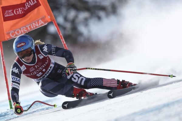 United States' Mikaela Shiffrin speeds down the course during an alpine ski, women's World Cup downhill race, in Cortina d'Ampezzo, Italy, Friday, Jan. 20, 2023. (AP Photo/Gabriele Facciotti)