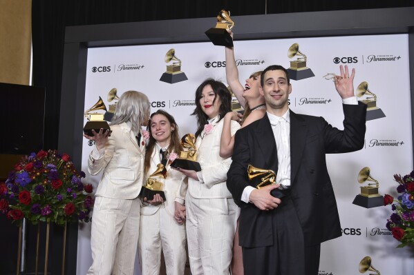 Phoebe Bridgers, from left, Julien Baker, and Lucy Dacus of boygenius pose in the press room with the awards for best rock performance and best rock song for 