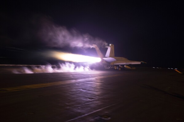 This image provided by the U.S. Navy shows an aircraft launching from USS Dwight D. Eisenhower (CVN 69) during flight operations in the Red Sea, Jan. 22, 2024. The U.S. and British militaries bombed multiple targets in eight locations used by the Iranian-backed Houthis in Yemen on Monday night, the second time the two allies have conducted coordinated retaliatory strikes on an array of the rebels' missile-launching capabilities. (Kaitlin Watt/U.S. Navy via AP)