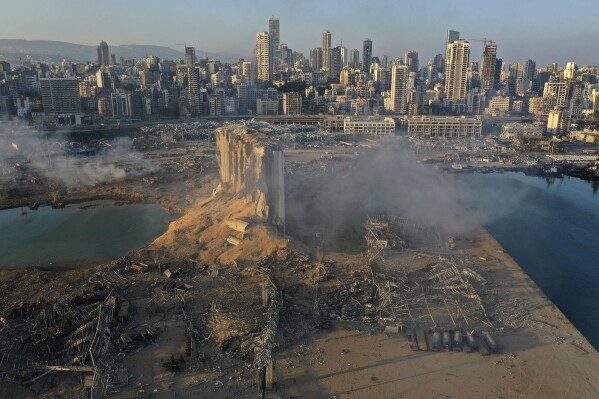 In this Aug. 5, 2020 file photo, a drone picture shows the destruction after an explosion at the seaport of Beirut, Lebanon. (AP Photo/Hussein Malla, File)