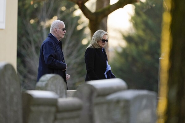 President Joe Biden and first lady Jill Biden arrive at St. Joseph on the Brandywine Catholic Church in Wilmington, Del., on Wednesday, Dec. 18, 2024. Wednesday marks the 52nd anniversary of the car crash that killed Joe Biden's first wife Neilia Hunter Biden and 13-month-old daughter Naomi. (AP Photo/Ben Curtis)