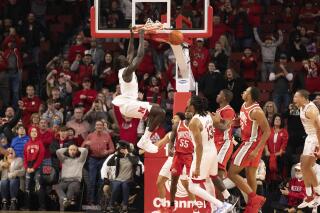 Nebraska's Lat Mayen (11) dunks against Ohio State during the second half of an NCAA college basketball game Sunday, Jan. 2, 2022, in Lincoln, Neb. Ohio State defeated Nebraska 87-79 in overtime. (AP Photo/Rebecca S. Gratz)
