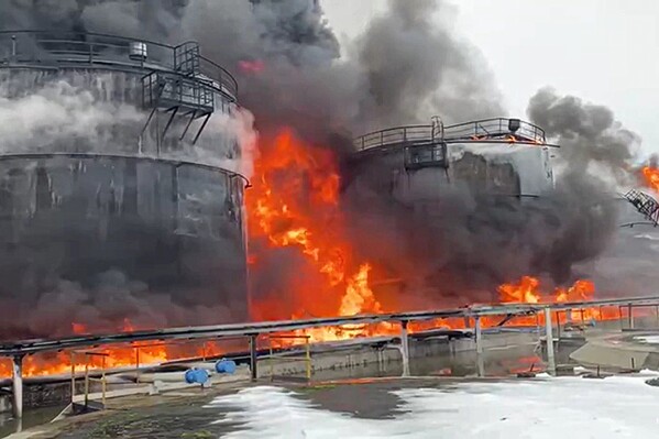 In this photo taken from video released by Governor of Bryansk Region Alexander Bogomaz telegram channel AV BogomaZ on Friday, Jan. 19, 2024, Oil reservoirs are seen in fire after the drone reached Klintsy, a city in Bryansk Region of Russia, about 60 kilometers (40 miles) from the Russia-Ukrainian border. A Russian official says a Ukrainian drone has struck an oil storage depot in western Russia, causing a massive blaze. (Governor of Bryansk Region Alexander Bogomaz telegram channel AV BogomaZ via AP)