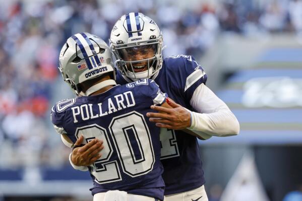 Dallas Cowboys' Dak Prescott congratulates Tony Pollard on his touchdown run during the first half of an NFL football game Sunday, Oct. 30, 2022, in Arlington, Texas. (AP Photo/Ron Jenkins)