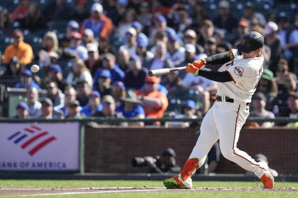 San Francisco Giants' Joc Pederson hits an RBI-single against the New York Mets during the first inning of a baseball game in San Francisco, Sunday, April 23, 2023. (AP Photo/Godofredo A. Vásquez)