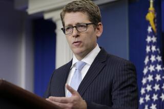 FILE - Then-White House Press Secretary Jay Carney gestures as he speaks during his daily news briefing at the White House in Washington, Monday, Feb. 3, 2014. On Friday, July 22, 2022, Carney, the top policy and communications executive at Amazon and one-time White House spokesman, was named the head of policy at Airbnb. (AP Photo/Carolyn Kaster, File)