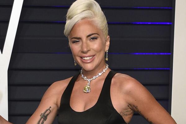 FILE - Lady Gaga, winner of the award for best song "Shallow," arrives at the Vanity Fair Oscar Party on Sunday, Feb. 24, 2019, in Beverly Hills, Calif. Gaga will be one of the presenters at the 94th Oscars on March 27 .(Photo by Evan Agostini/Invision/AP, File)