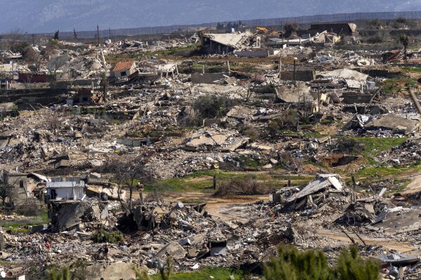Destroyed houses caused by the Israeli air and ground offensive, in the town of Kfar Kila, southern Lebanon, Tuesday, Feb. 18, 2025. (AP Photo/Hassan Ammar)