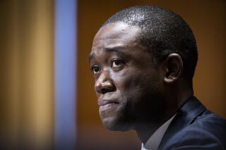 FILE - In this Feb. 23, 2021, file photo Wally Adeyemo testifies before the Senate Finance Committee during his confirmation hearing to be Deputy Secretary of the Treasury in Washington. The Biden administration took aim Tuesday, Sept. 21, at the financial marketplace for criminal ransomware gangs, announcing sanctions against a Russia-based virtual currency brokerage that officials say has processed illicit transactions for attackers. The goal of the action is to go after the “financial enablers” of ransomware gangs, Deputy Treasury Secretary Wally Adeyemo told reporters in previewing the announcement. (Jim Lo Scalzo/Pool via AP, File)